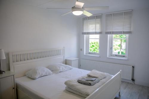 Postel nebo postele na pokoji v ubytování Vakantiewoning op het sluisplateau 23 Wemeldinge