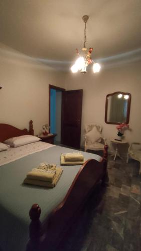 a bedroom with a bed with two towels on it at Pirro & Sharon House in Pianore