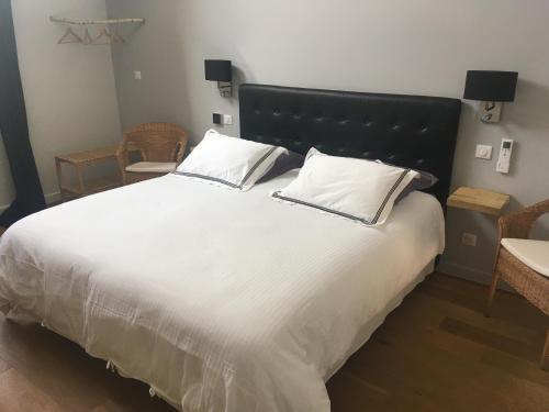 Ένα ή περισσότερα κρεβάτια σε δωμάτιο στο Le Clos n°5