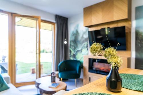 Televízia a/alebo spoločenská miestnosť v ubytovaní Apartament Górska Polana by Apart Concept Podhale