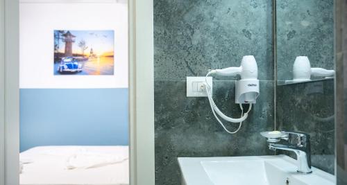 a bathroom with a sink and a mirror at Hotel Luris in Golem