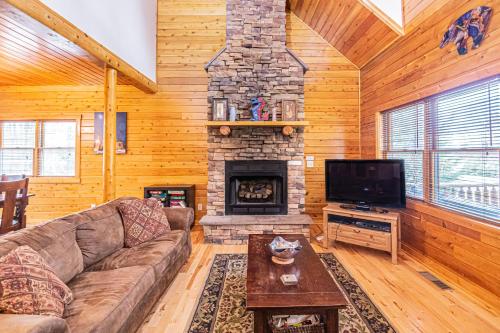 a living room with a couch and a fireplace at Donovans Dacha in McHenry