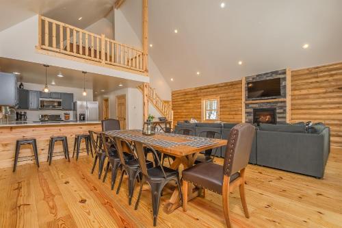 a kitchen and dining room with a table and chairs at Almost Eden in McHenry