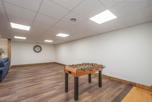 a room with a table in the middle of a room at Happy Ours in McHenry