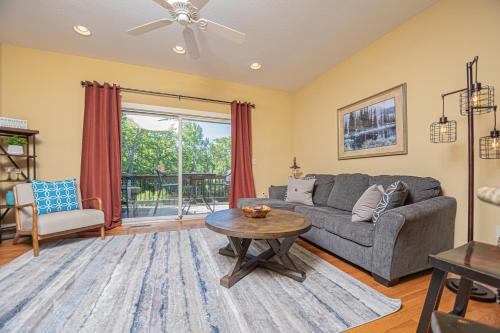 a living room with a couch and a table at Live a Little in McHenry
