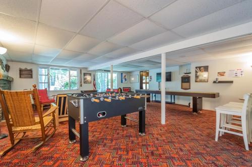 a living room with a pool table and chairs at Just Around the Dilly in Swanton