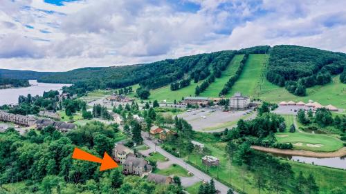 an aerial view of a resort with an orange arrow pointing to a village at Marsh Run Cove in McHenry