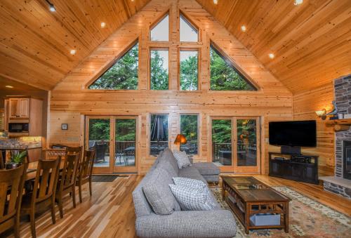 a living room with a large window in a cabin at Claralea Lodge in Oakland