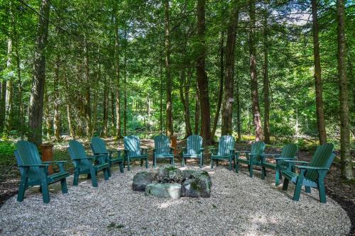 a group of blue chairs sitting around a fire pit at Claralea Lodge in Oakland