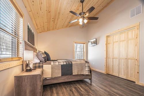 a bedroom with a bed and a ceiling fan at Hearthstone in McHenry