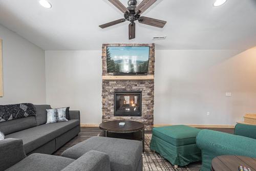 a living room with a couch and a fireplace at Hearthstone in McHenry