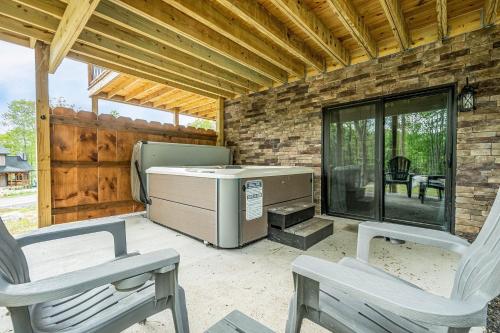 a patio with two chairs and a grill on a patio at Hearthstone in McHenry