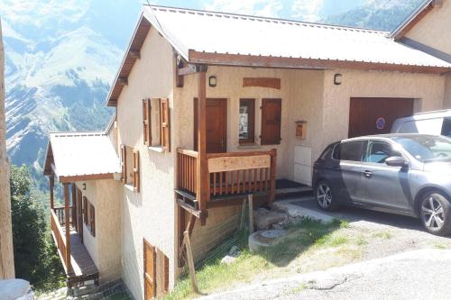 a house with a car parked in front of it at Orion chalet facing the Meije - 10 persons in La Grave