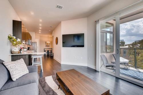 a living room with a couch and a table at Capitol View Condos - Downtown Austin - Lone Star in Austin
