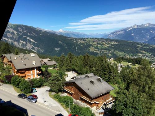 an aerial view of a large house in the mountains at Apartment in Anzère in Anzère