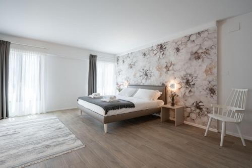 a bedroom with a bed and a wall mural at Palace Canal View by Wonderful Italy in Venice