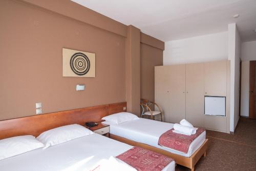 Una cama o camas en una habitación de Hotel Akropol