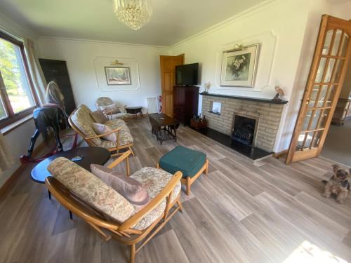 an aerial view of a living room with a fireplace at Drummond House - Pets welcome free, 3 acres of gardens, free parking in Brackley