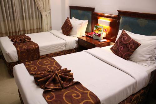 Ένα ή περισσότερα κρεβάτια σε δωμάτιο στο Hotel West Valley - Baridhara