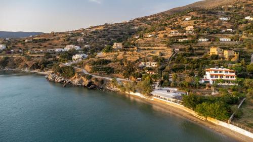 an aerial view of a beach with houses on a hill at Agia Marina Apartments 7 Andros in Andros