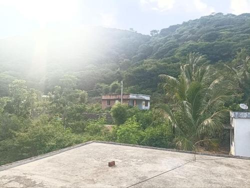 a view of a mountain from the roof of a house at BHASURI SERVICED VILLA Attappady in Varagampadi