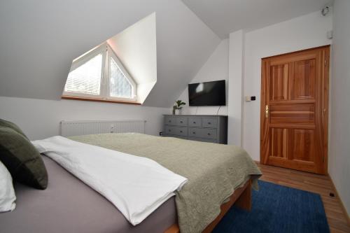 Ένα ή περισσότερα κρεβάτια σε δωμάτιο στο Black Hill Apartments