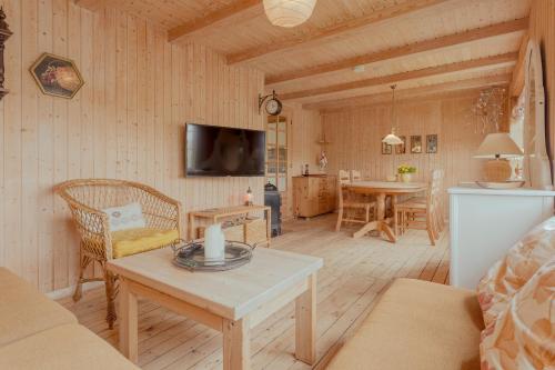 a living room with a couch and a table at Stunning Sea View - 3BR - Beach - Scenic Village in Leynar