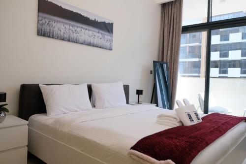 Postel nebo postele na pokoji v ubytování Mira Holiday Homes - Cozy studio in Meydan
