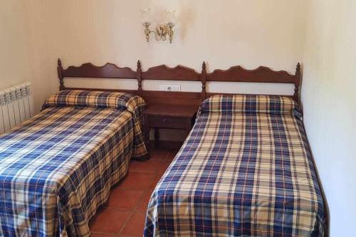 Postel nebo postele na pokoji v ubytování Hostal Montemayor