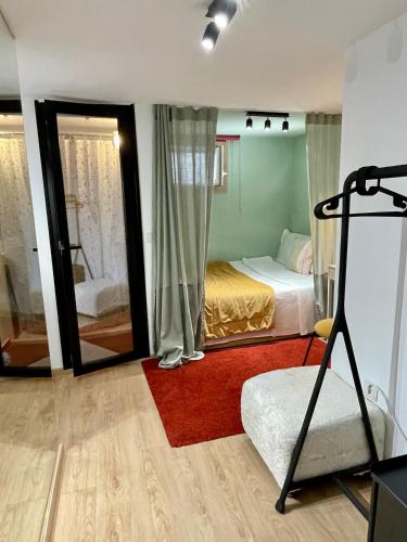 a bedroom with a bed and a mirror at Ministerium underground studio in Thessaloniki