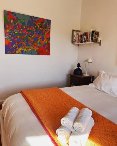 a bedroom with a bed with two towels on it at Espacio Shangrila.One in Uceda