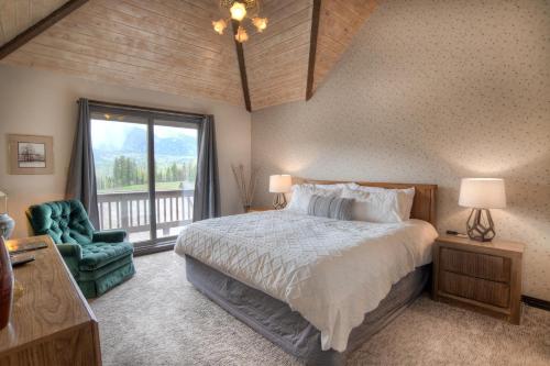 a bedroom with a large bed and a window at Cascade Village 50 Near Purgatory - Marmot Meadows Retreat in Durango Mountain Resort