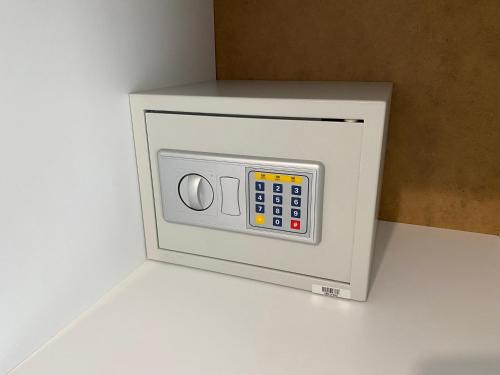 a microwave oven with its door open on a counter at Momo's House in Nikiti