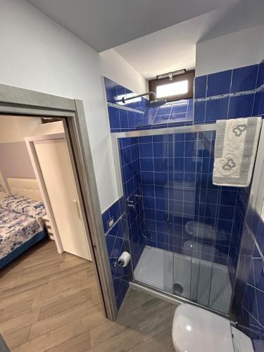 a bathroom with a shower and a toilet at Da Nonna Nina Casa Vacanza in Acciaroli