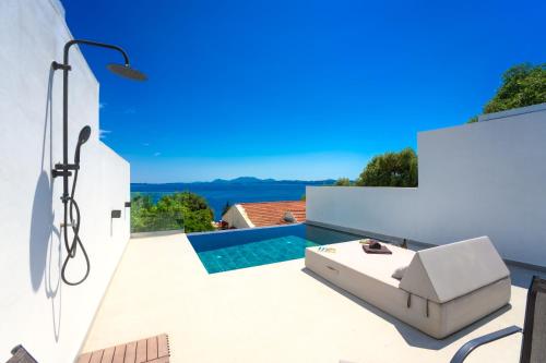 a view of the pool from the patio of a house at Akrogiali Apartments in Barbati