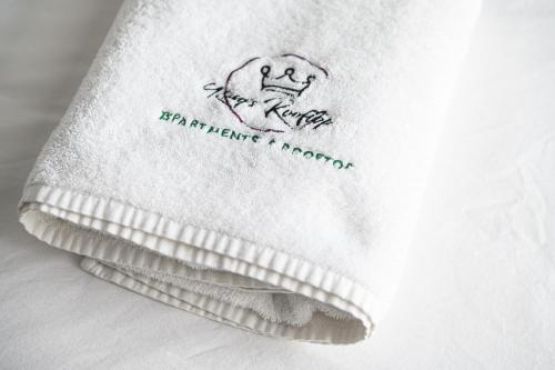 a white towel with a drawing on it at King's rooftop in Tel Aviv