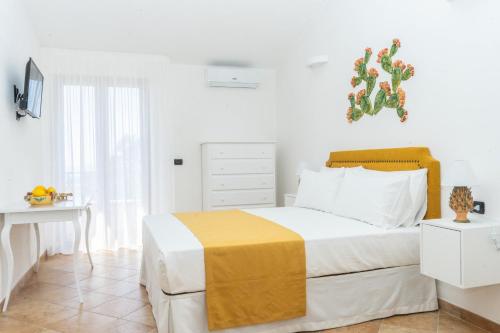 Ένα ή περισσότερα κρεβάτια σε δωμάτιο στο Relais Ruggiero