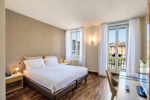 Un ou plusieurs lits dans un hébergement de l'établissement Albergo Firenze