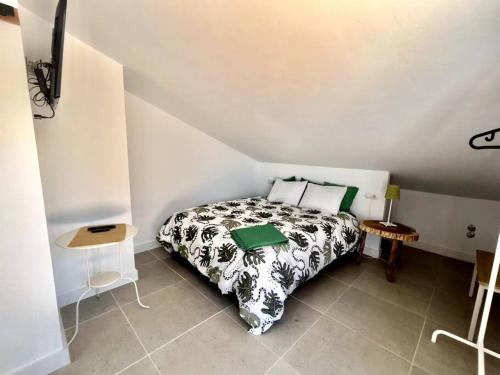 a bedroom with a bed in a small room at El puente de lata 2 in Granada