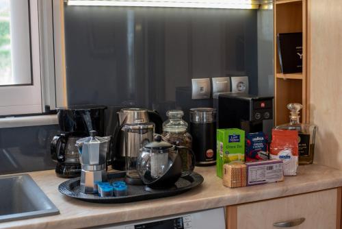 a kitchen counter with various appliances on a counter top at Five Stars Villa in Skala Kefalonias