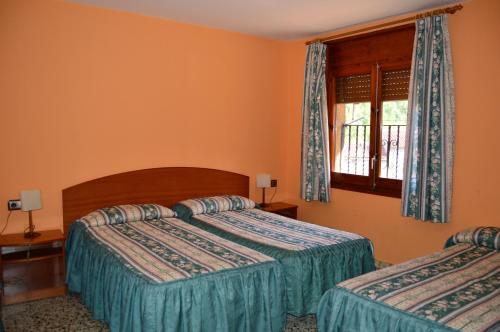 Postel nebo postele na pokoji v ubytování Hostal l'Escon