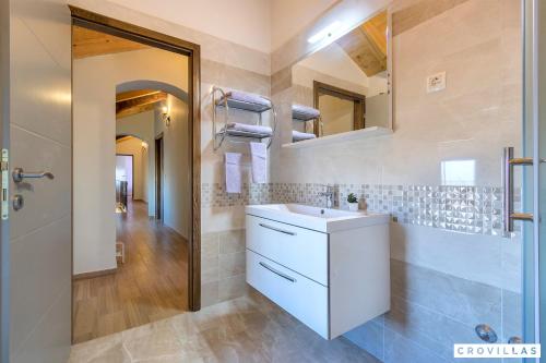 a bathroom with a sink and a mirror at Ive in Orbanići