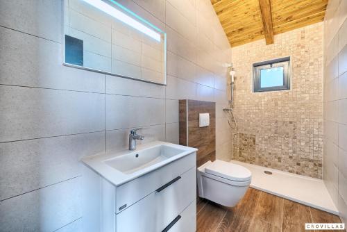 a bathroom with a sink and a toilet at Lux Ii in Murter