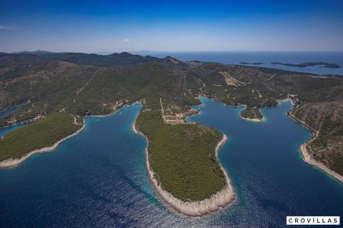 an aerial view of a group of islands in the water at Nella Hvar in Rudina