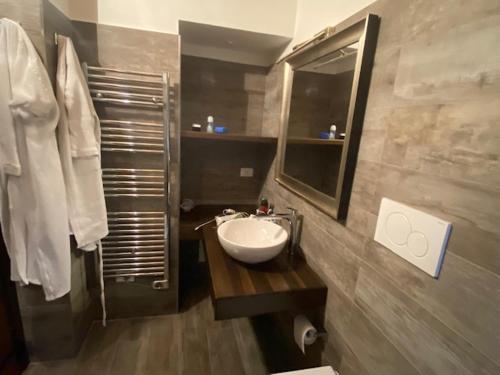 a bathroom with a sink and a mirror at Gli Orti dei Doria di dolceacqua in Dolceacqua