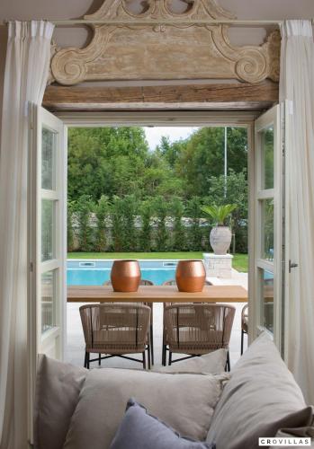 a living room with a couch and a large window at Zoe in Ladići