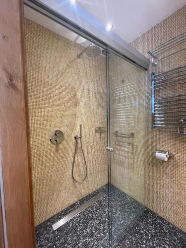 a bathroom with a shower with a glass door at Amsterdam-bnb in Amsterdam