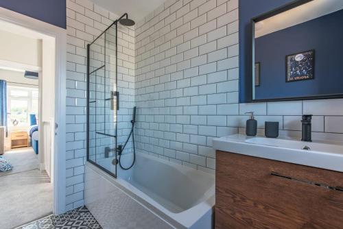 a bathroom with a shower and a sink at Spacious Southampton House Sanctuary in the City in Southampton