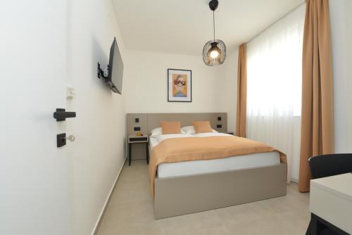 Ένα ή περισσότερα κρεβάτια σε δωμάτιο στο Apartment MI Čiovo with private HOT TUB and garden