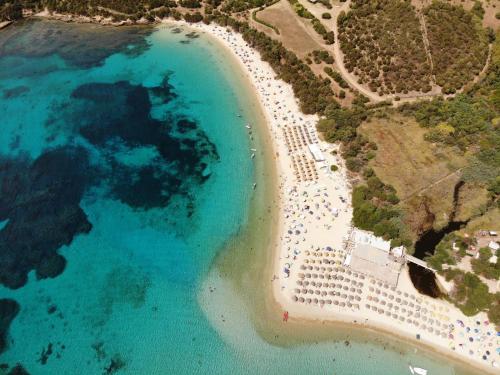 an aerial view of a beach and the ocean at Eco Village Baia Delle Ginestre in Teulada